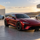 AI-generated color inspiration showing ruby red, pale blue and silver cars in a sunlit courtyard.