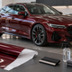 AI-generated concept of a burgundy car with colored film and installation tools