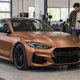 AI illustration of a buyer and inspector reviewing a copper wrapped coupe before purchase